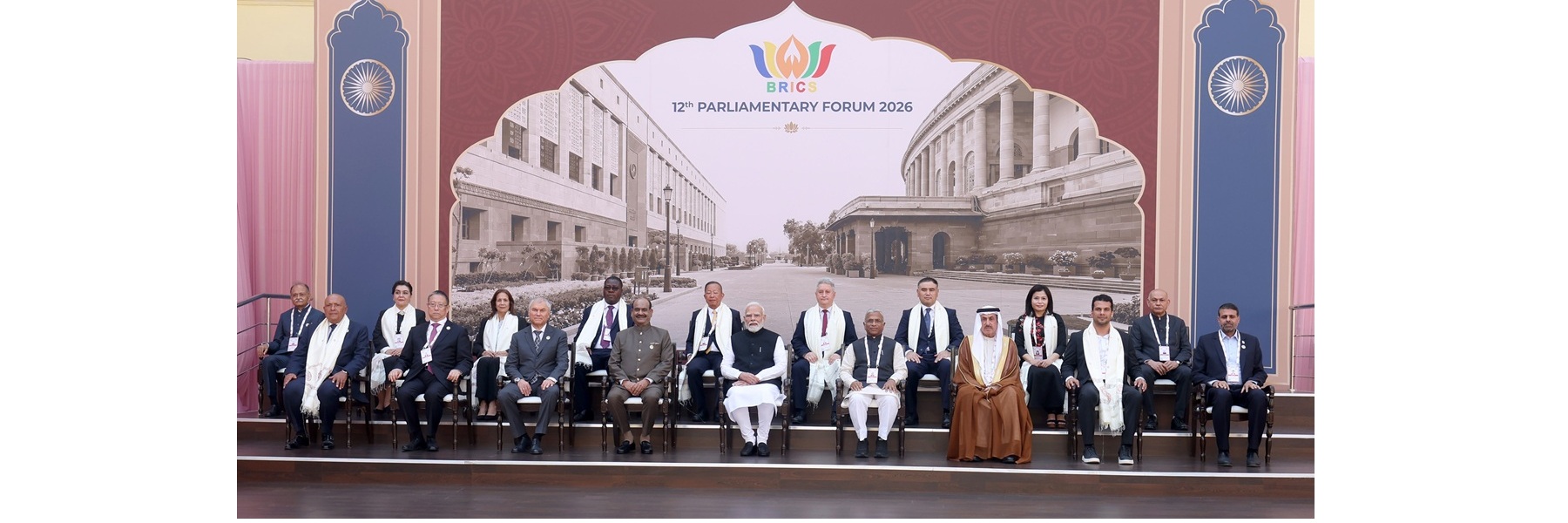 PM in a group photograph with the leaders of visiting delegations during the 12th BRICS Parliamentary Forum at Central Hall of Samvidhan Sadan, in New Delhi