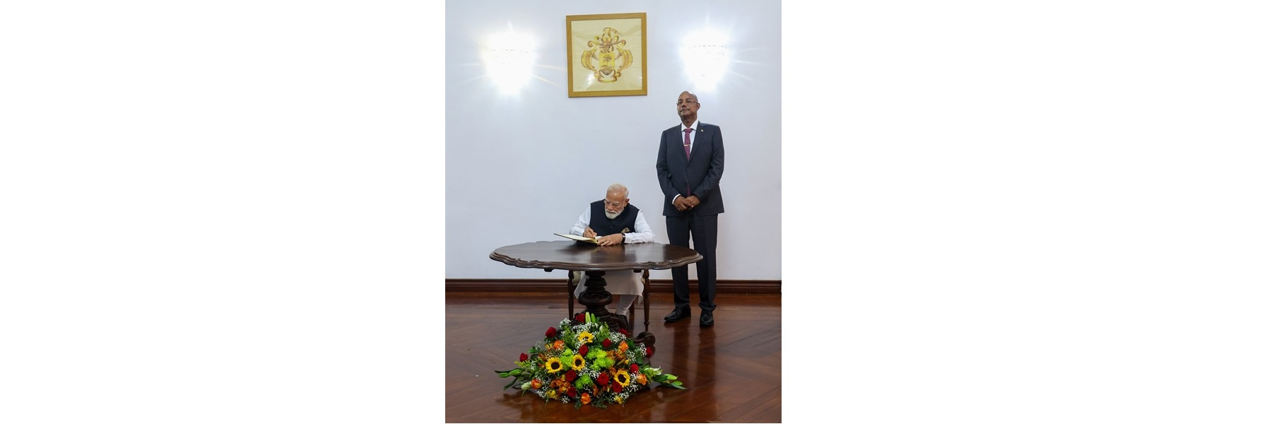 PM signs the State House Visitors’ Book during his courtesy visit to State House at Victoria, in Seychelles.
