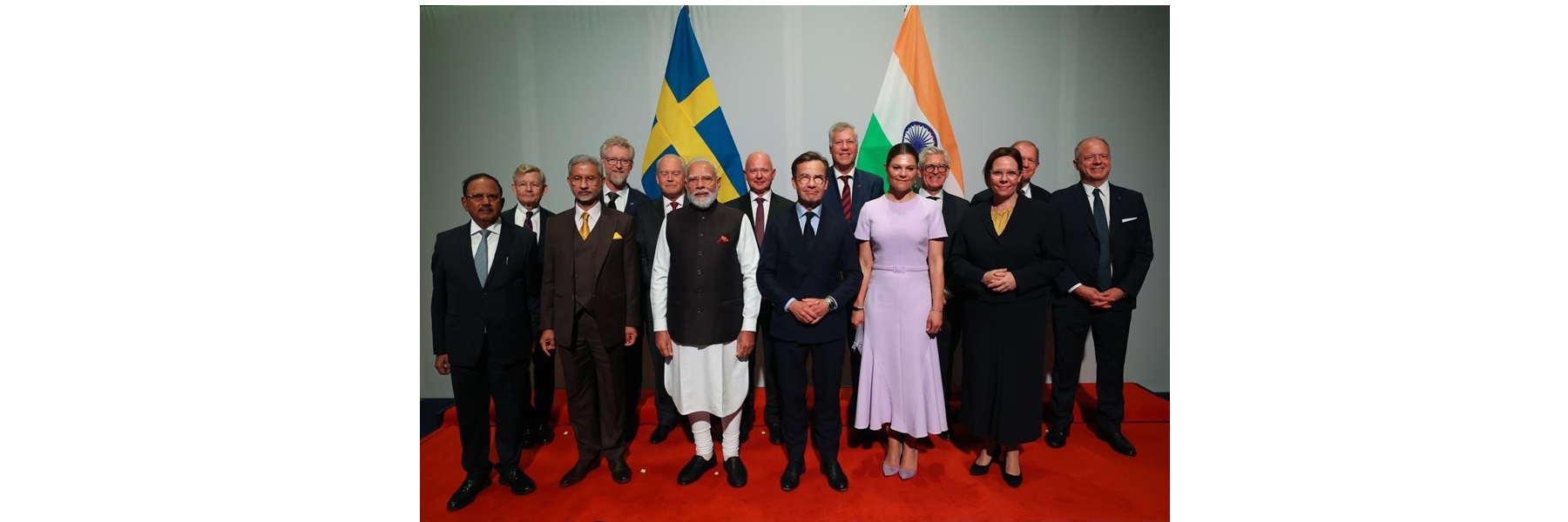 PM in a group photograph with leading Swedish CEOs, in Sweden