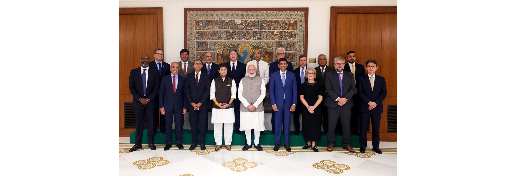 PM in a group photograph with Global System for Mobile Communications Association (GSMA) Board members at Seva Teerth, in New Delhi.