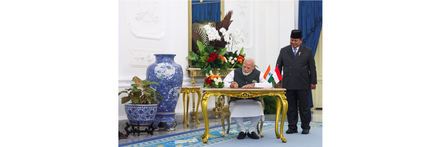 PM signs the guest book at the Presidential Palace in Jakarta, Indonesia.