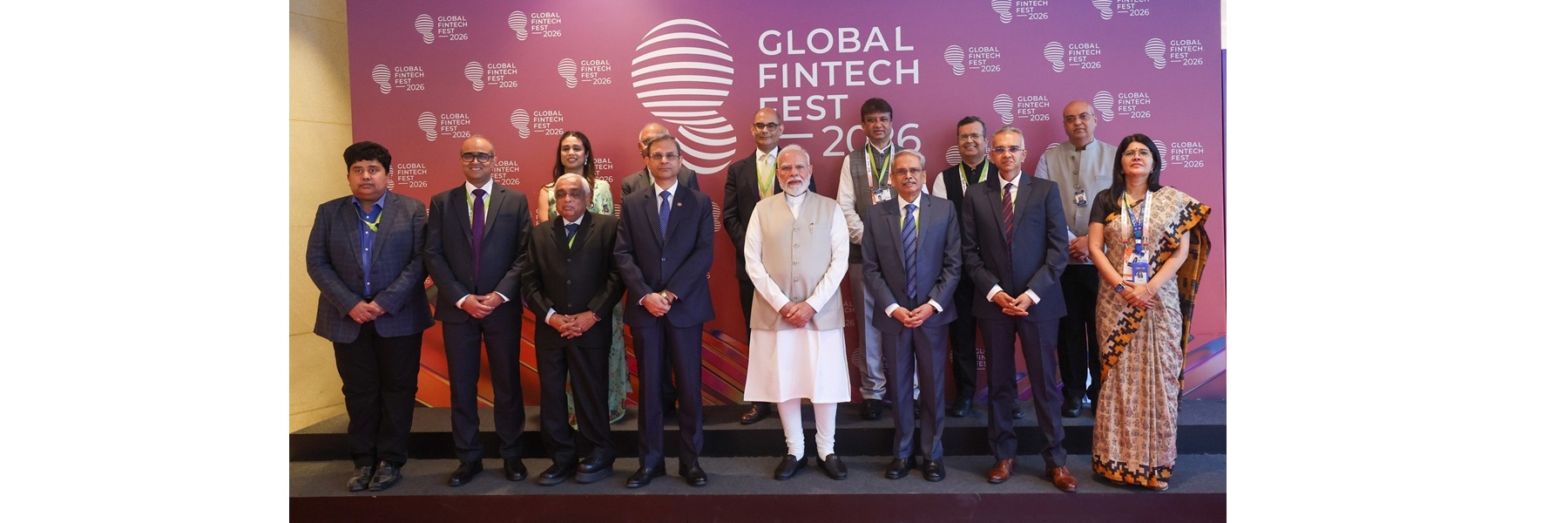 PM in a group photograph during the Global Fintech Fest (GFF) 2026 at Mumbai, in Maharashtra
