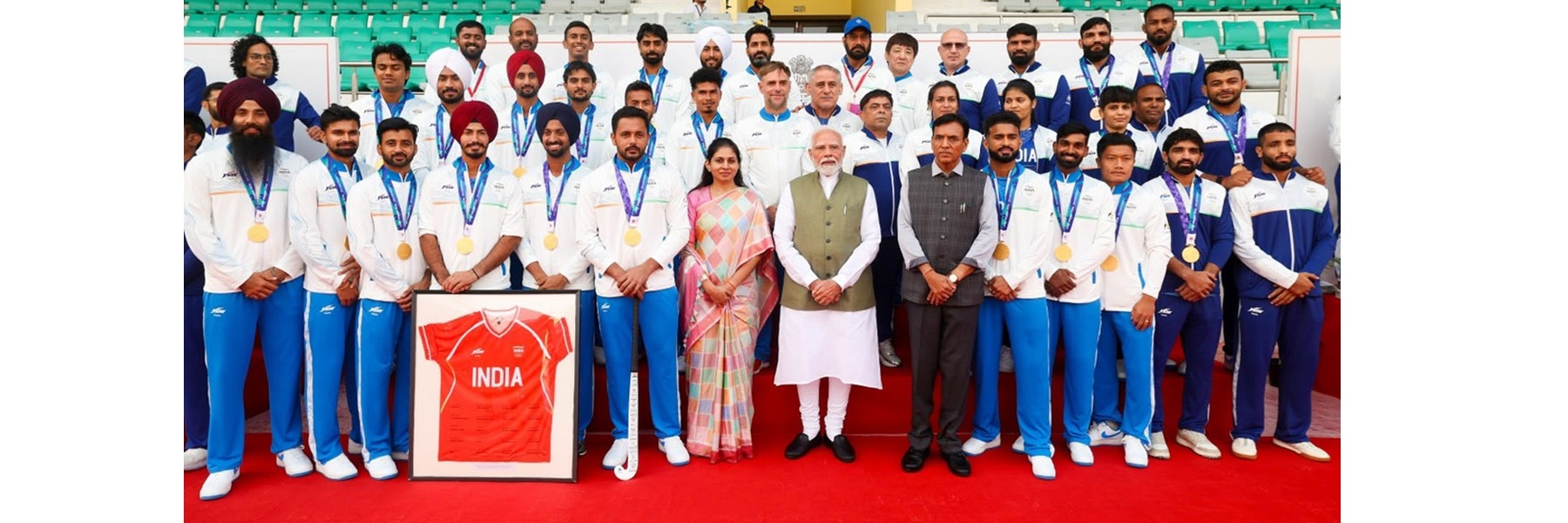 PM in a group photograph with the Indian Contingent for Asian Games 2026, in New Delhi