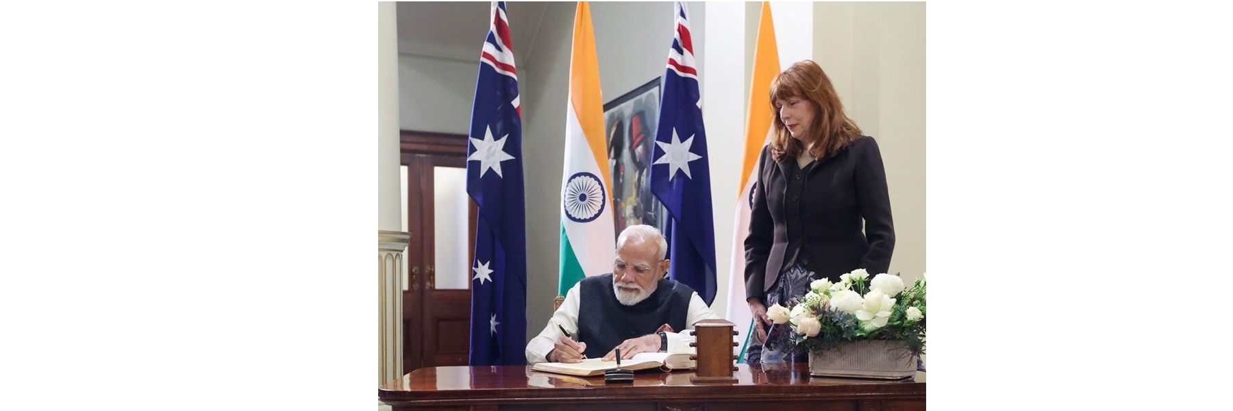 PM signs the visitors’ book at the Government House in Melbourne, Australia